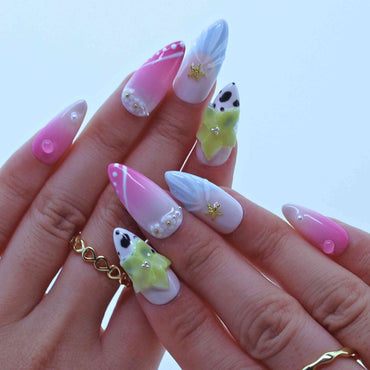 Hand with pink and white nail art on a light blue background