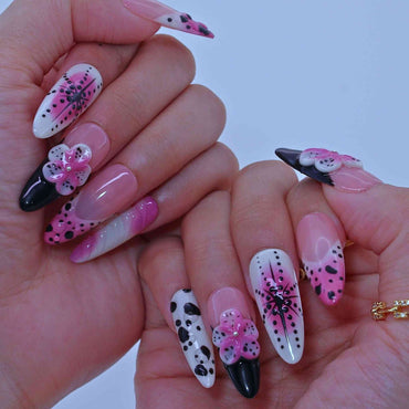 Nails with pink, black, and white designs ,Dotted Blossom Nails with black dots, purple florals, hand-painted art by Tennail