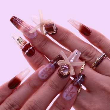 Close-up of a hand with decorative nail art, Tennail handmade press on nails.