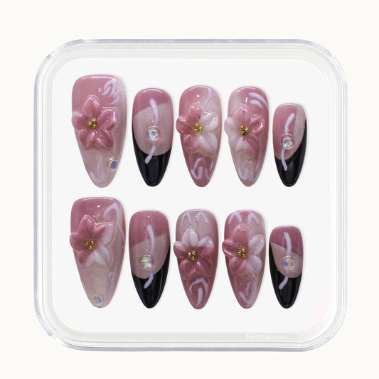 Medium Almond Tennail press-ons with pink Ombré, Cat Eye finish, and 3D floral accents.