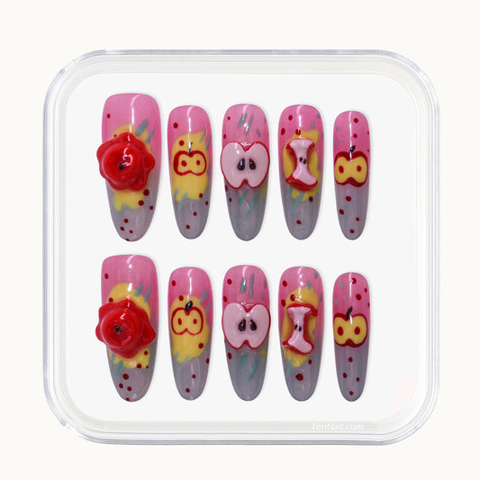 Long Oval Tennail press-ons with colorful Hand Painted cartoon splatters and 3D apple charms.