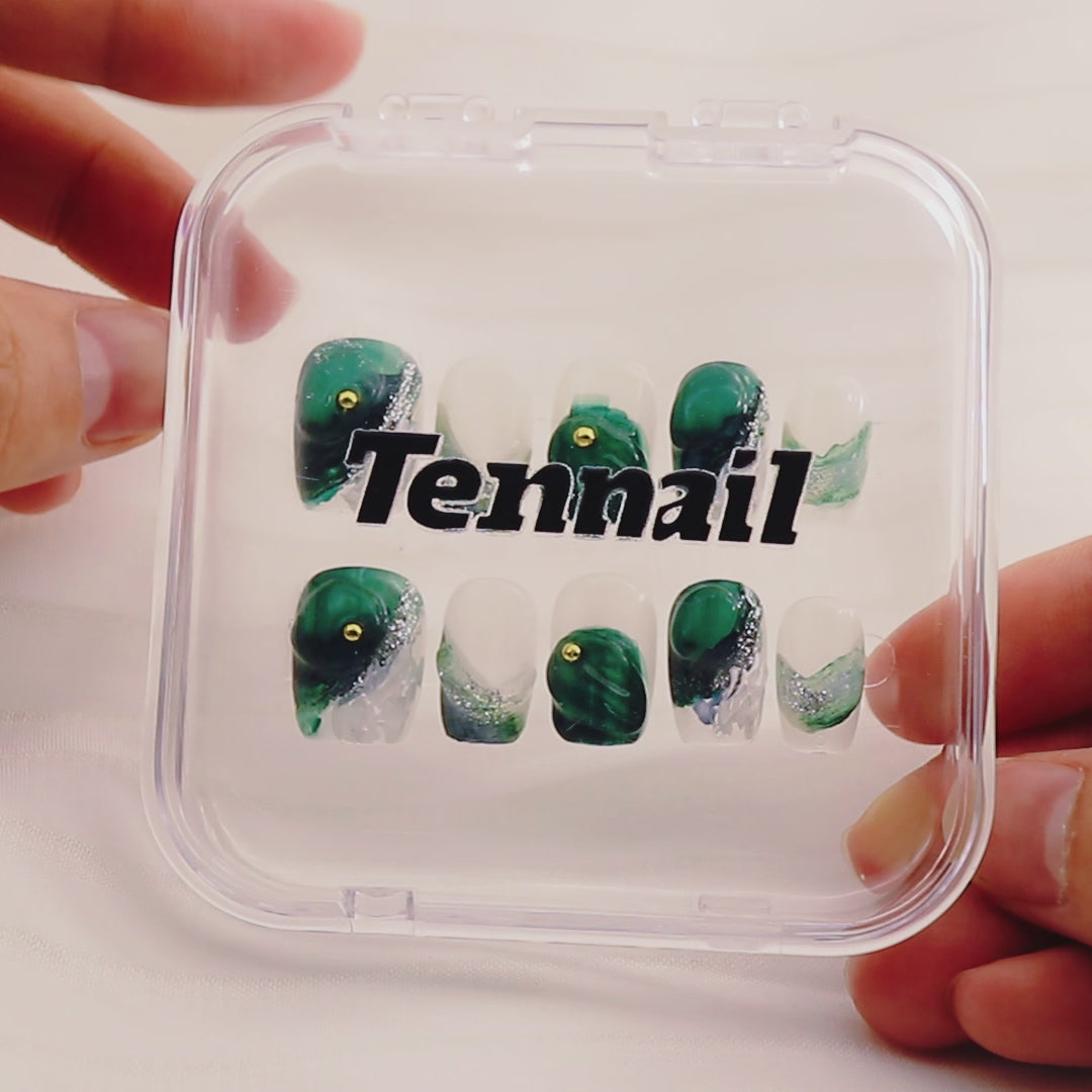 Video shows TenNail's Forest Dew Nails: Handmade press - ons with dark green matte gradients and gem - like cat - eye elements catch the light as hands move, creating a fresh forest atmosphere that's perfect for a natural nail style.