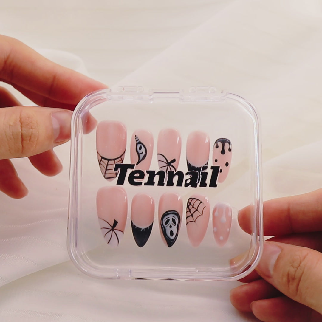 Video shows TenNail's Spooky Pink Nails: Press - on nails with pink bases, black skulls, and spider webs catch the light as hands move, creating a cute and spooky Halloween atmosphere that's perfect for celebrating the holiday.