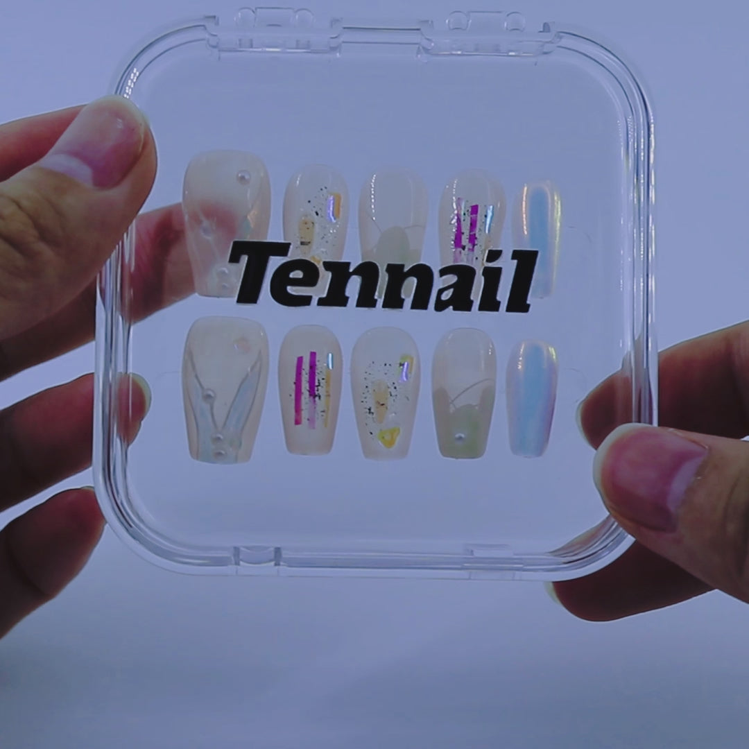 Video shows TenNail's Mermaid Aurora Nails: iridescent accents, soft pastels, and delicate white details on a translucent base shimmer as hands move, capturing a mermaid's glow under an aurora.