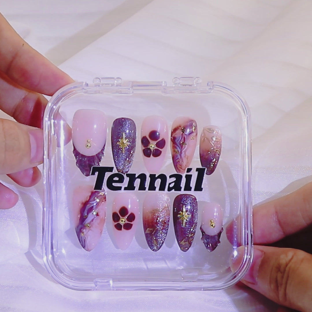 Video shows TenNail's Luna Gold Branch Nails: Press - on nails with brown cat - eye, golden star - like glows, and gold foil branch accents catch the light as hands move, creating a luxurious and stylish look that beautifully enhances your elegance.