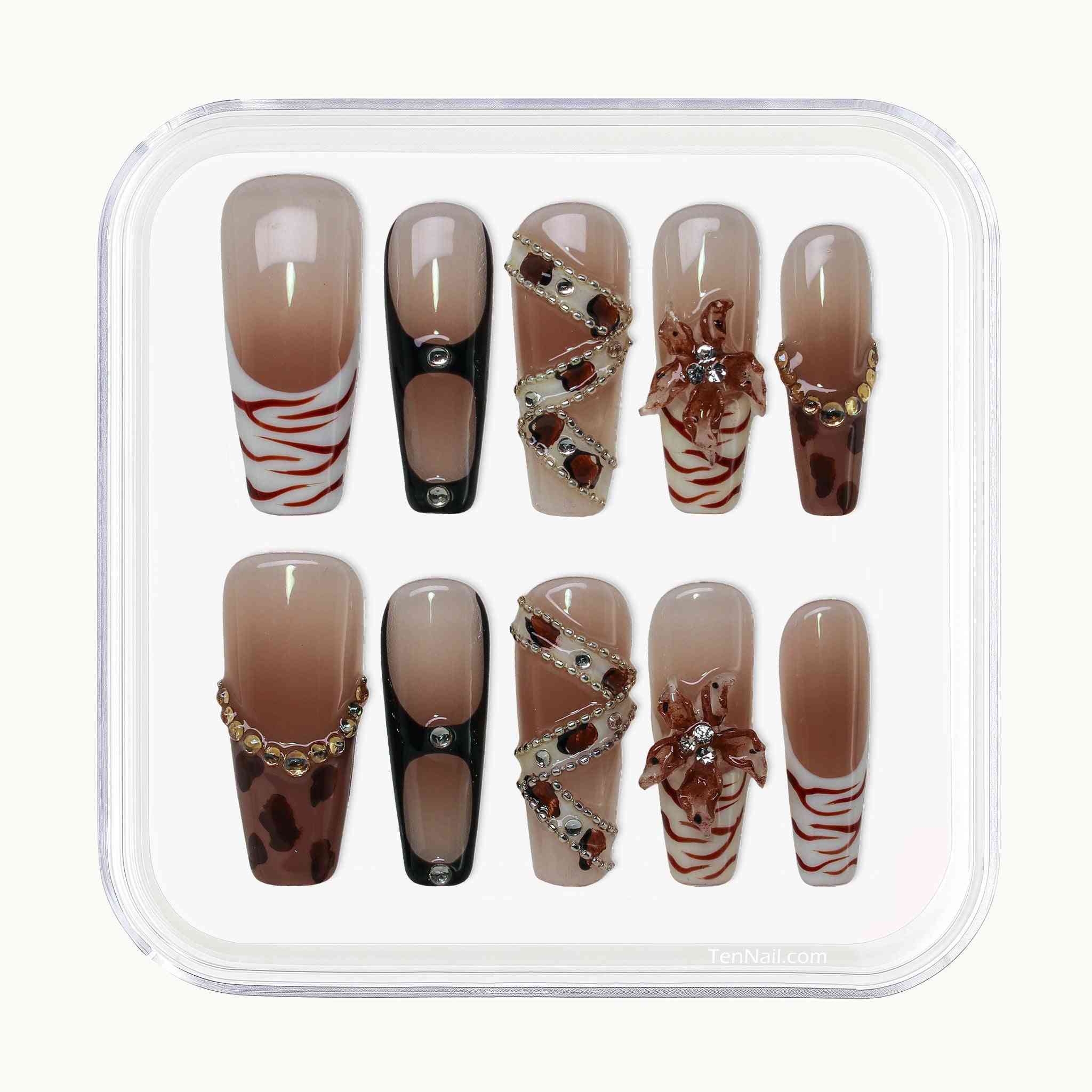 Set of decorative false nails with various designs in a clear container. by Tennail press on nails.