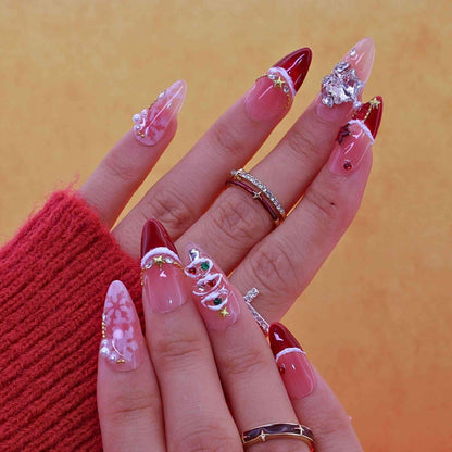 Hand with red and clear acrylic nails on a yellow background by Tennail press on nails