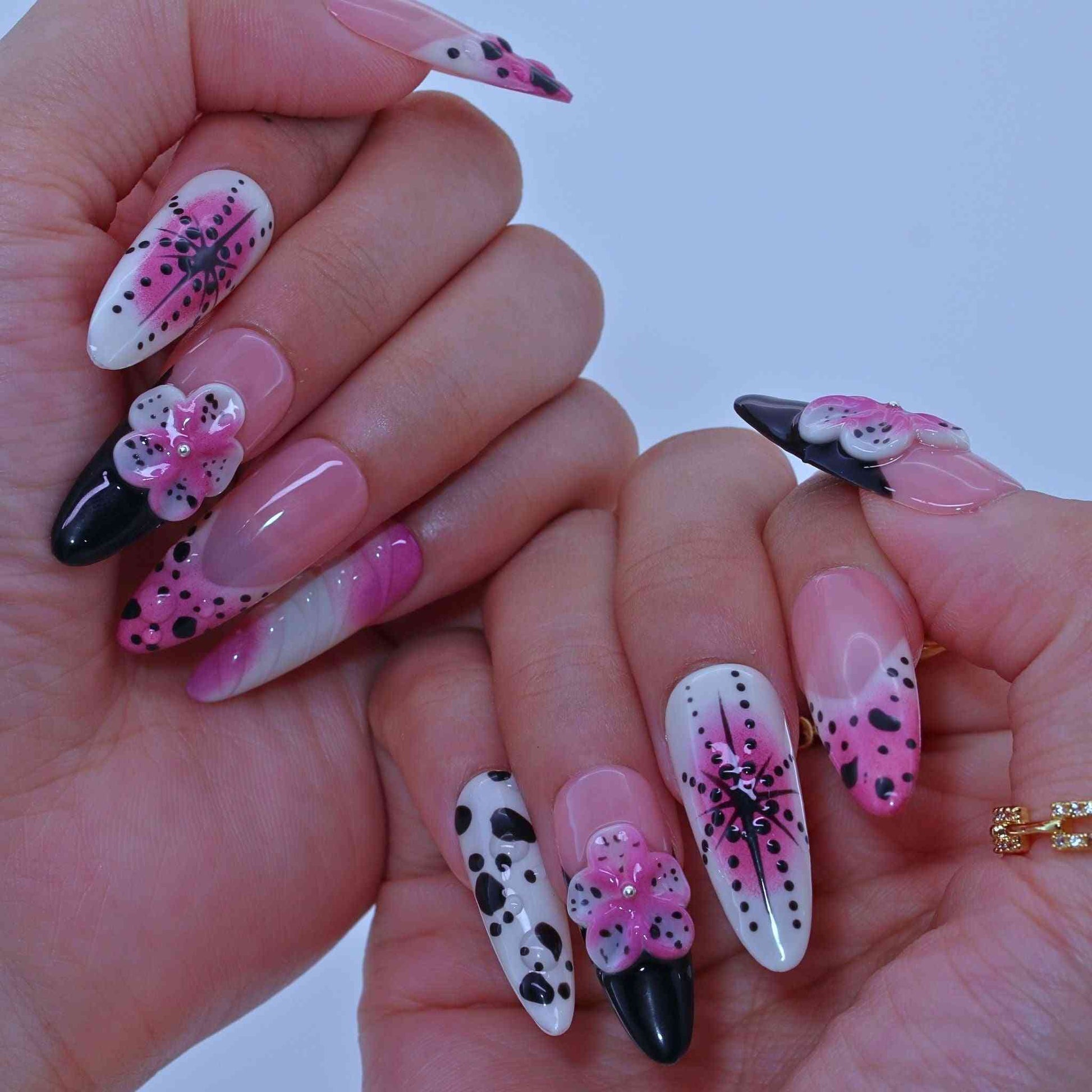 Nails with pink, black, and white designs ,Dotted Blossom Nails with black dots, purple florals, hand-painted art by Tennail
