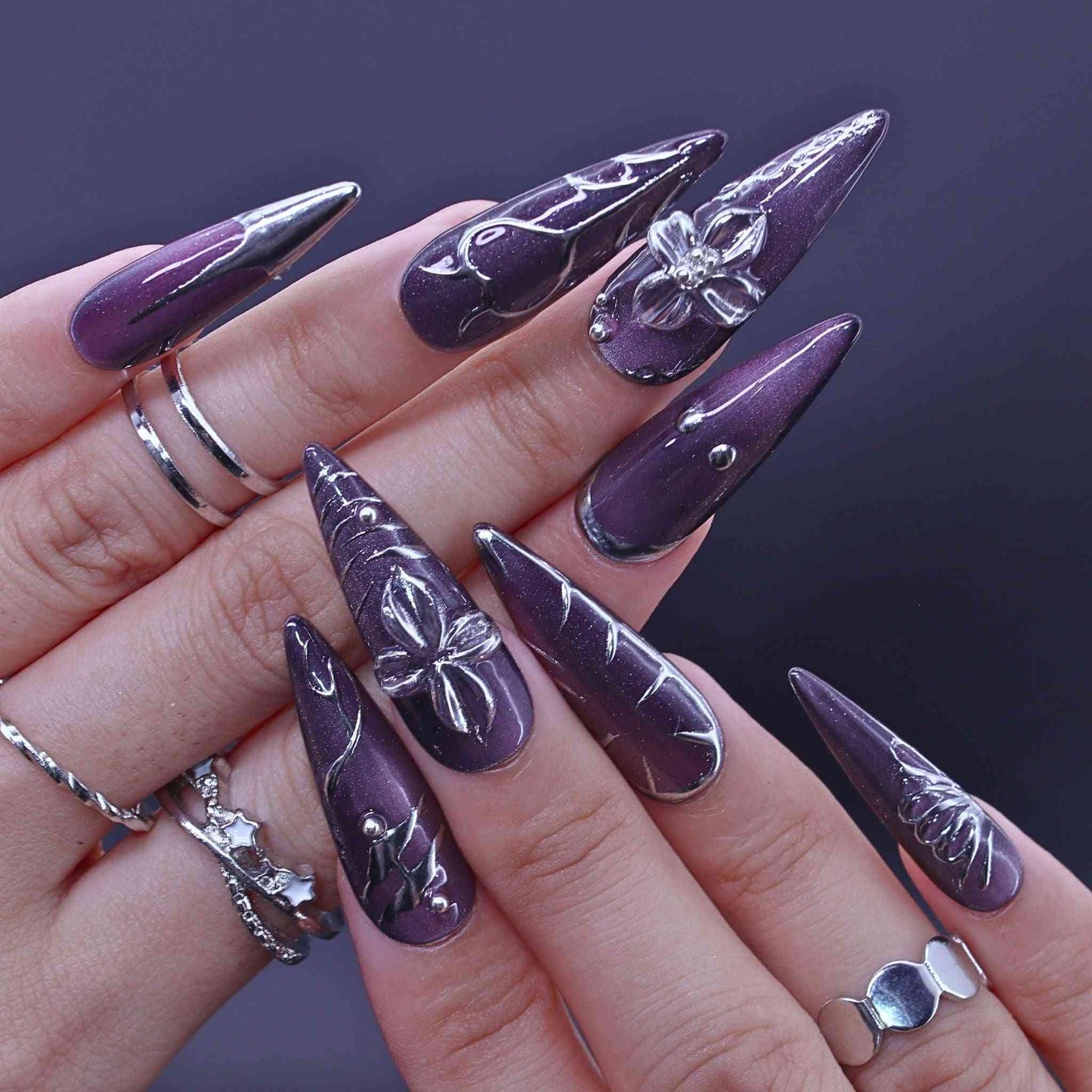 Purple stiletto nails with silver butterfly designs, Lavender Art press on Nails with lavender cat-eye, hand-painted florals, sleek design by Tennail