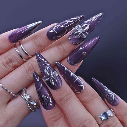 Purple stiletto nails with silver butterfly designs, Lavender Art press on Nails with lavender cat-eye, hand-painted florals, sleek design by Tennail