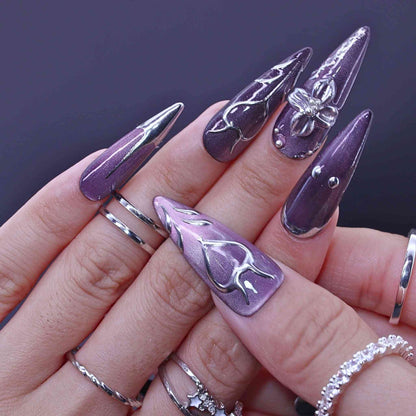 Hand with purple and silver nail art , Lavender Art press on Nails with lavender cat-eye, hand-painted florals, sleek design by Tennail