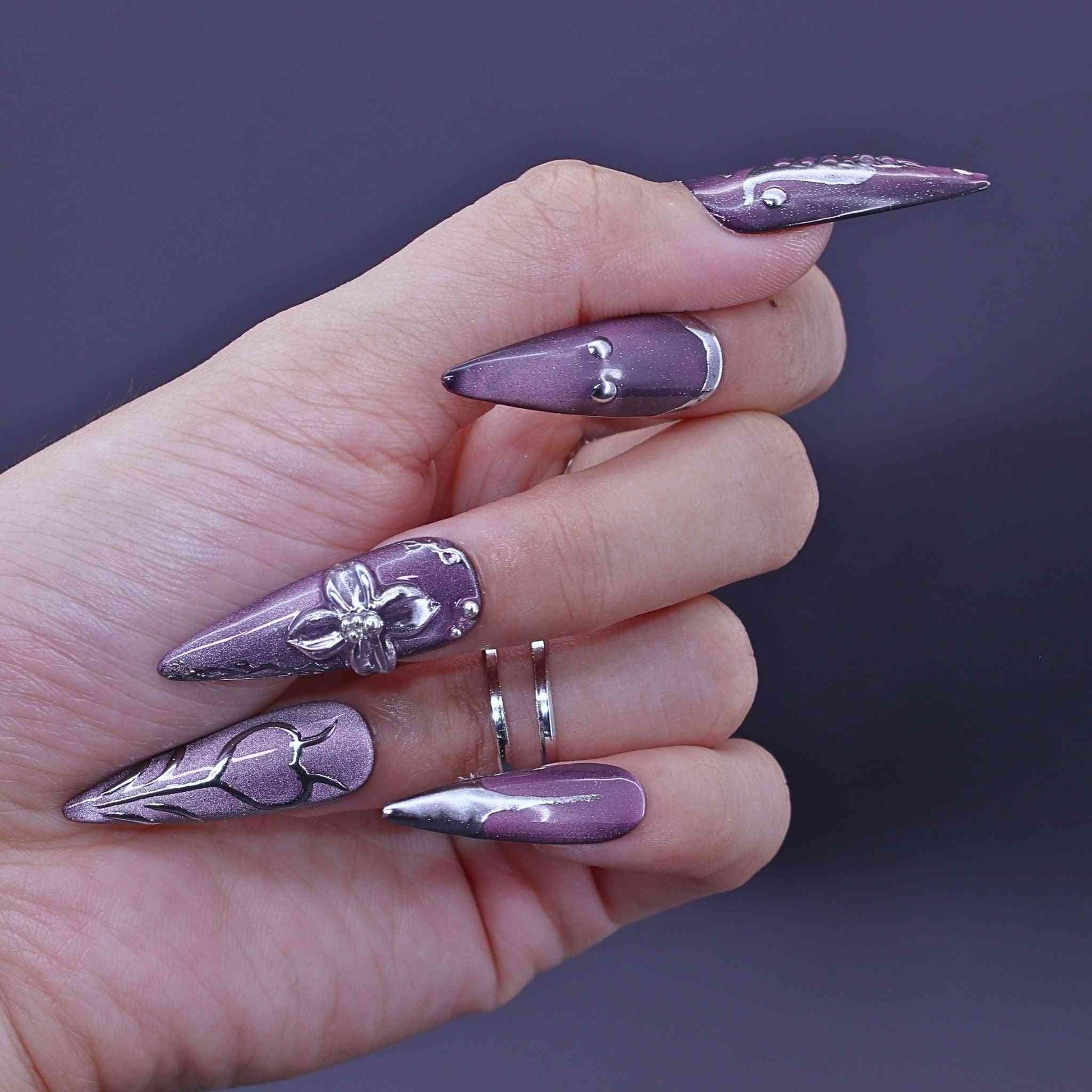 Hand with purple nail art, Lavender Art press on Nails with lavender cat-eye, hand-painted florals, sleek design by Tennail