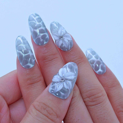 Nails with floral design and clear overlay, Aqua Wave press on Nails with hand-painted waves, aqua cat-eye, floral accents by Tennail.