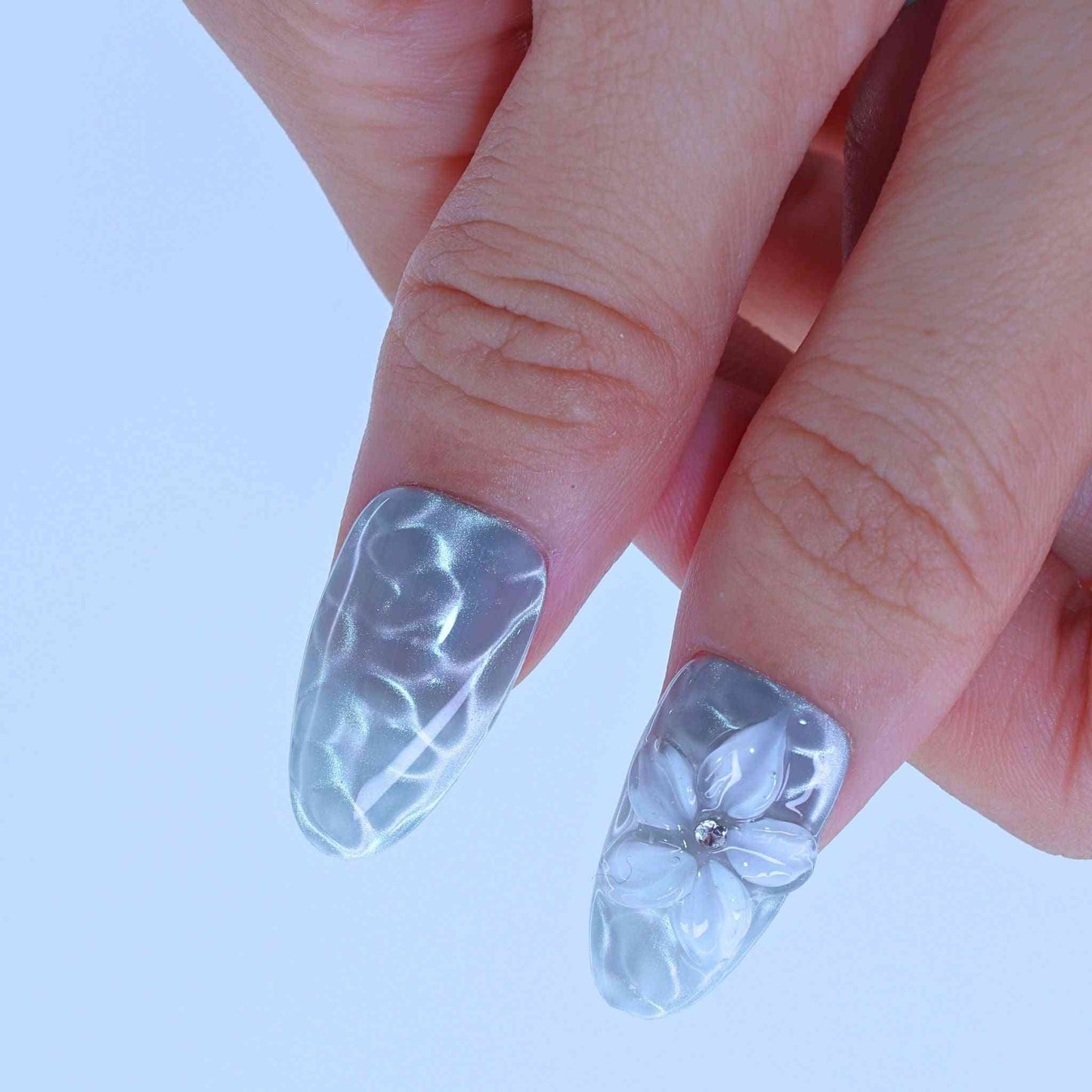 Clear nail polish with floral design, Aqua Wave press on Nails with hand-painted waves, aqua cat-eye, floral accents by Tennail.