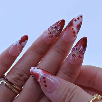 Nails with red and white floral design, Tropical Flowers Press on Nails with hand-painted florals, red gradients, delicate accents by Tennail.