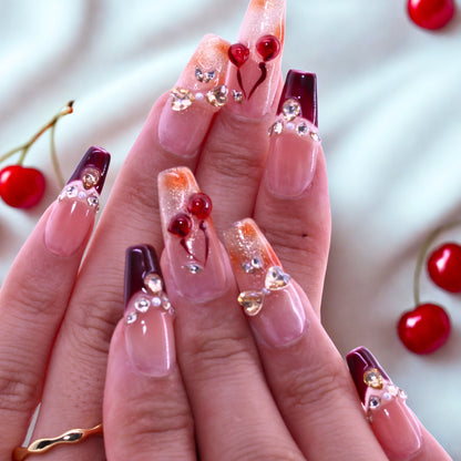 T2511N059 Cherry Blossom Glow Nails byTenNail, Nails with cherry and heart decorations on a light background
