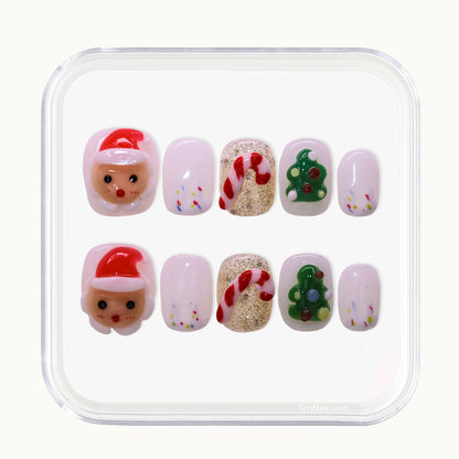 Short Christmas press on nails with Santa and candy cane designs.