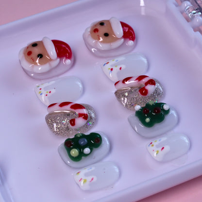Short Christmas press on nails with Santa and candy cane designs.