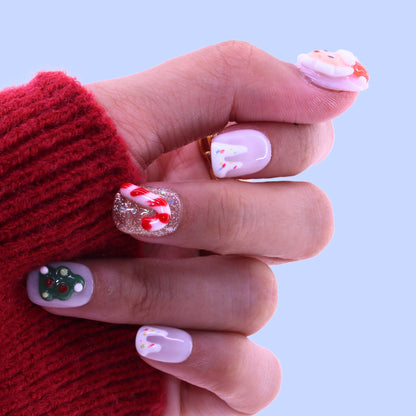 Hand with decorated nails against a light purple background, Tennail handmade press on nails.