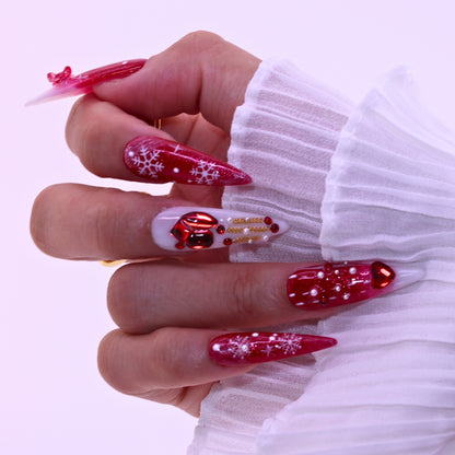 Close-up of a hand with red and white nail art, Tennail handmade press on nails.