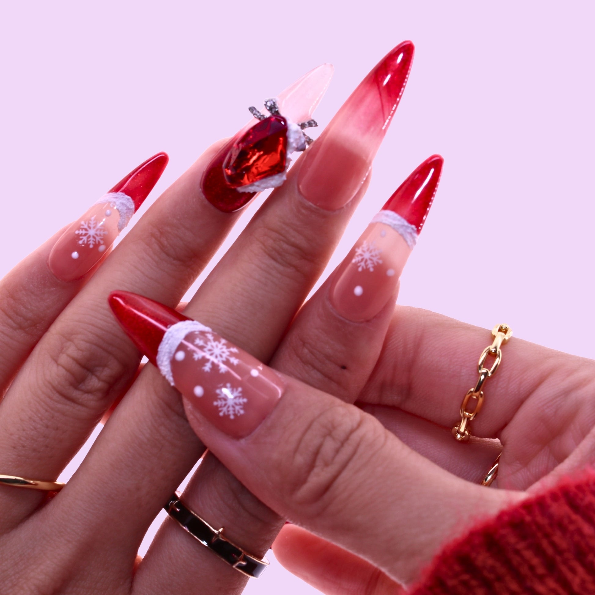 Close-up of a hand with red and white nail design, Tennail handmade press on nails.