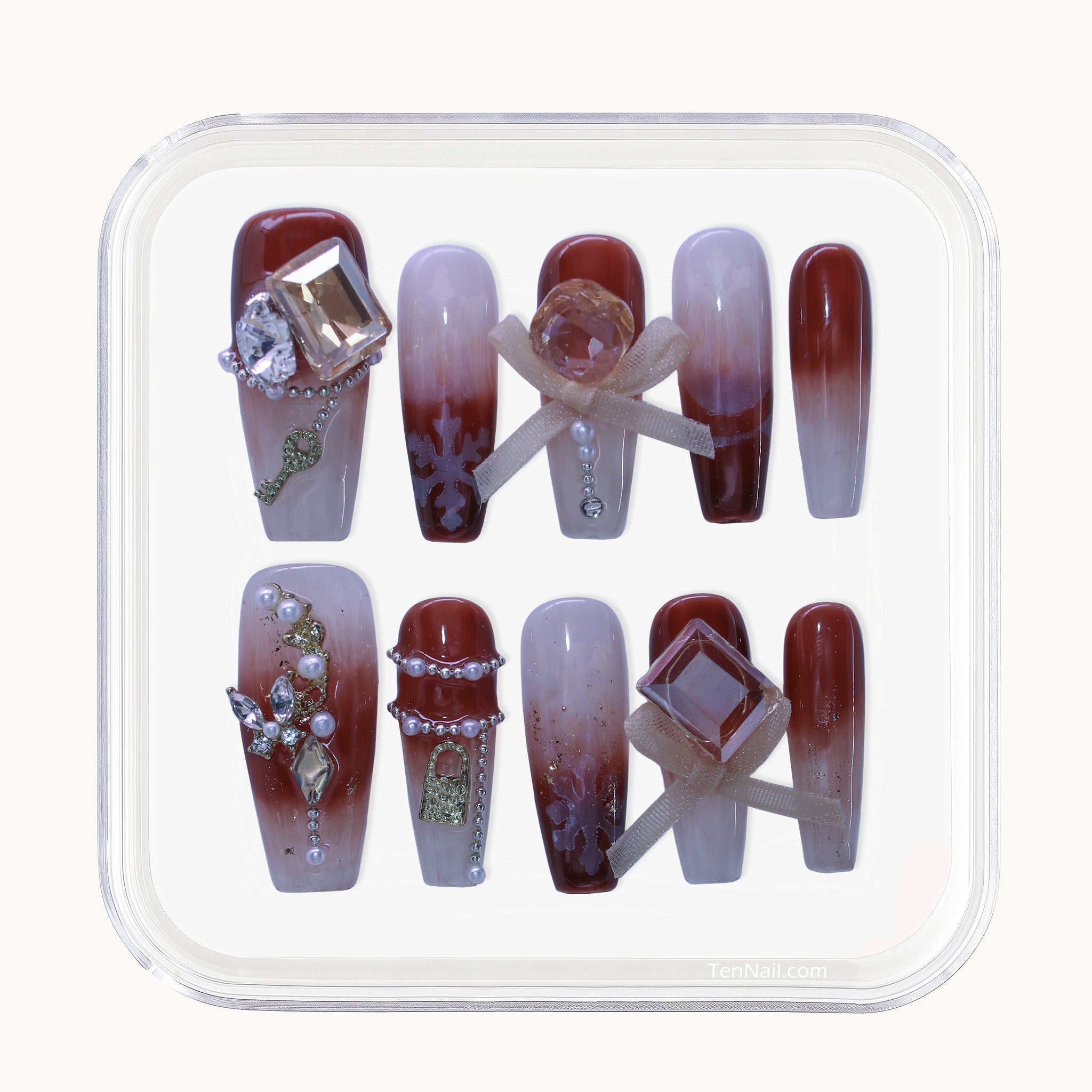 Long Coffin press-on nails with Maillard brown Ombré, rhinestone, and pearl 3D accents.