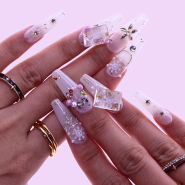 Hand with decorative false nails, Tennail handmade press on nails.