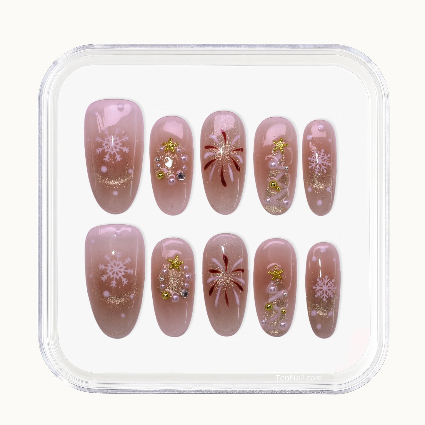 Medium Almond press-on nails with nude blush color, hand painted Christmas trees, and glitter.
