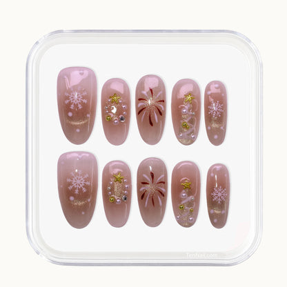 Medium Almond press-on nails with nude blush color, hand painted Christmas trees, and glitter.