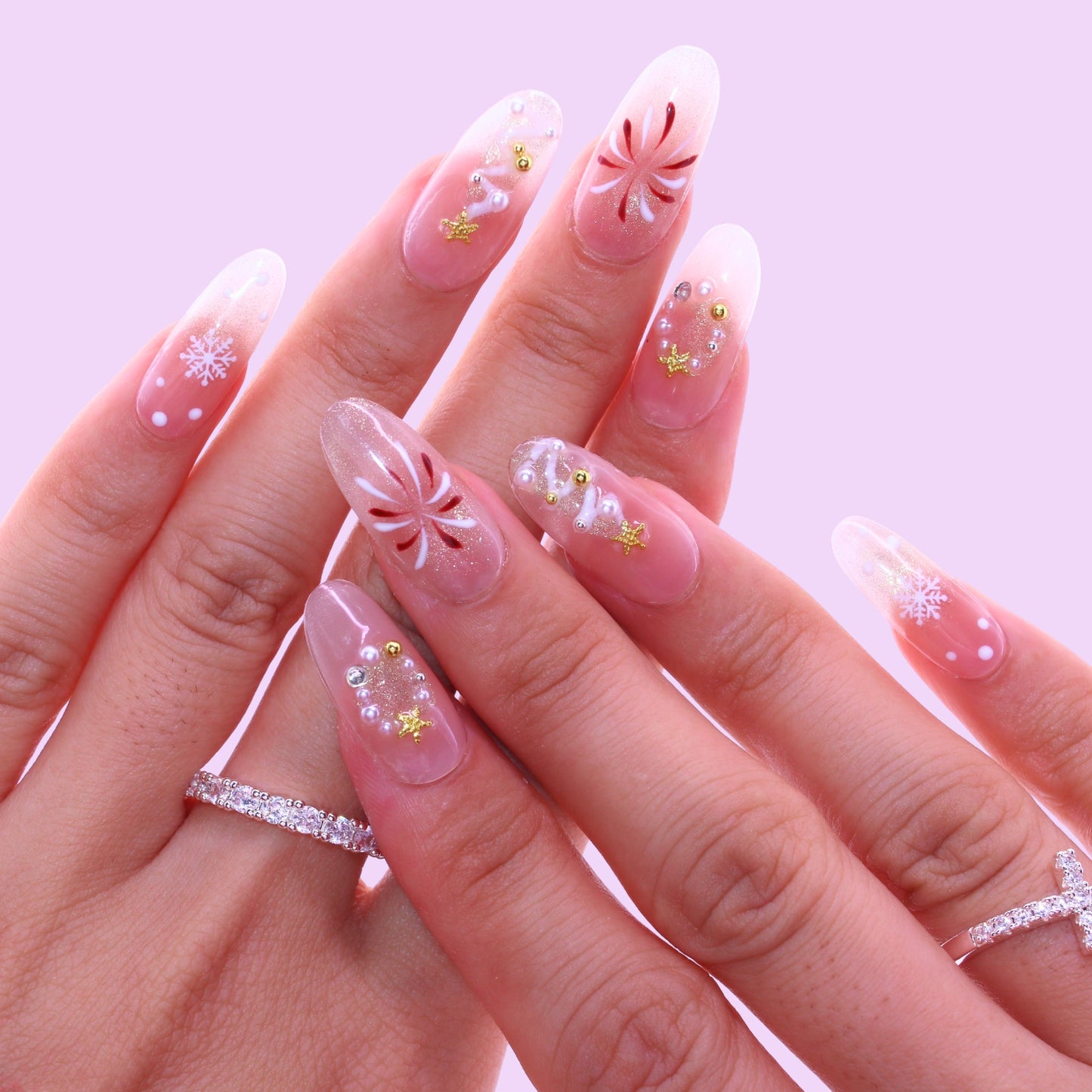 Hand with decorative nail art, Tennail handmade press on nails.