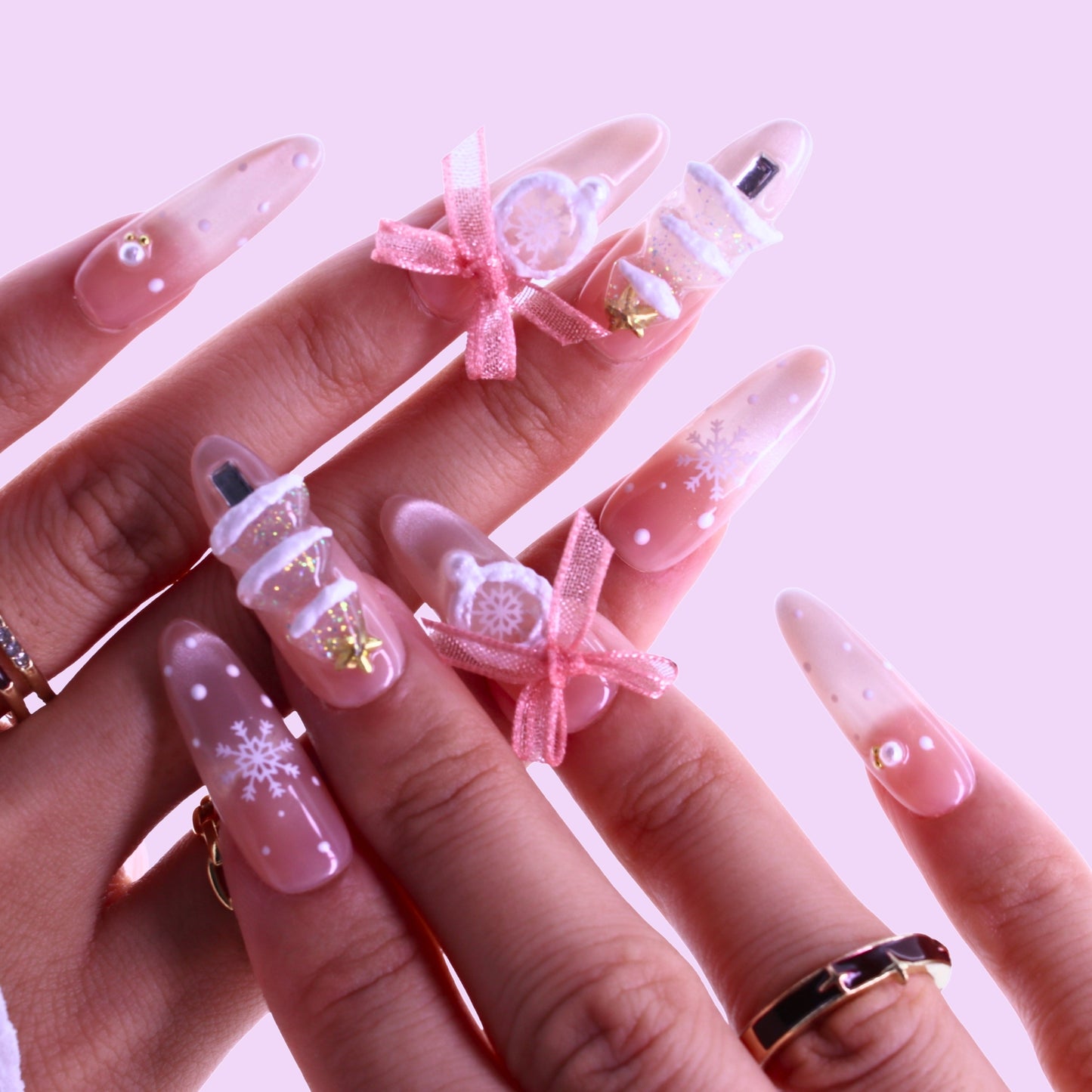 Nails with decorative designs including bottles and bows, Tennail handmade press on nails.