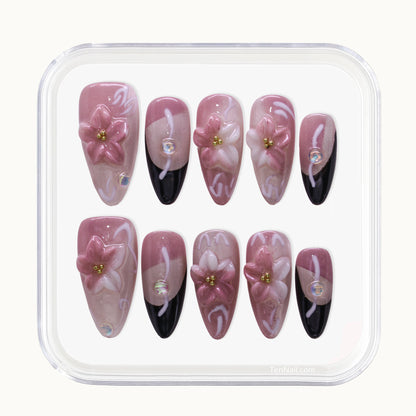 Medium Almond Tennail press-ons with pink Ombré, Cat Eye finish, and 3D floral accents.