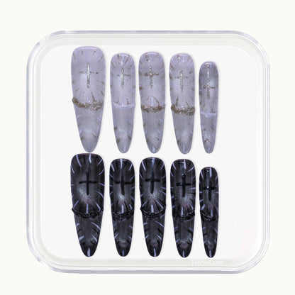 Long Stiletto Tennail press-ons in black and white Cat Eye with Gothic cross religious symbols.