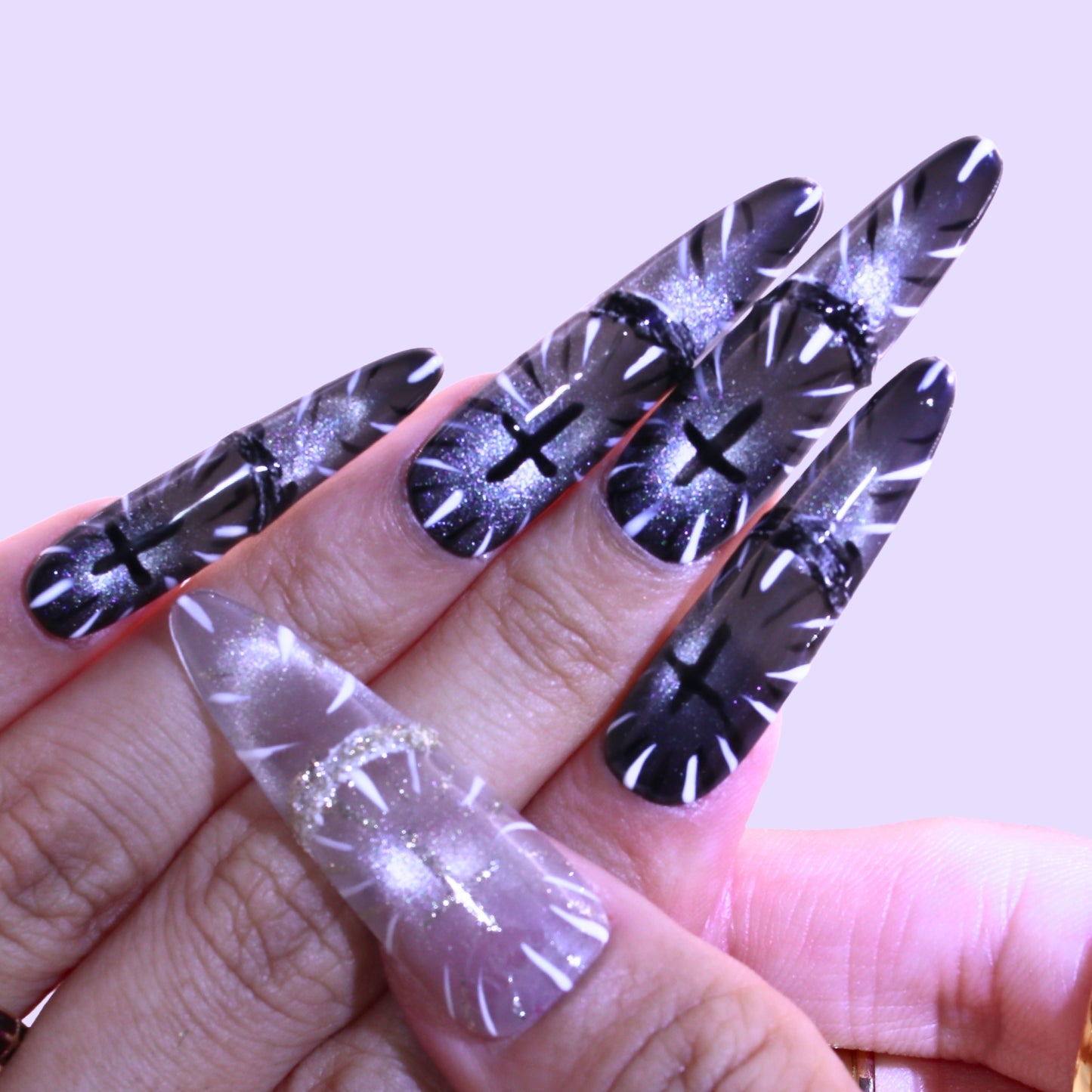 Nail art with black and silver leaf designs, Tennail handmade press on nails.